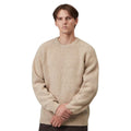 A man wearing a beige textured knit crewneck sweater, standing against a plain white background.