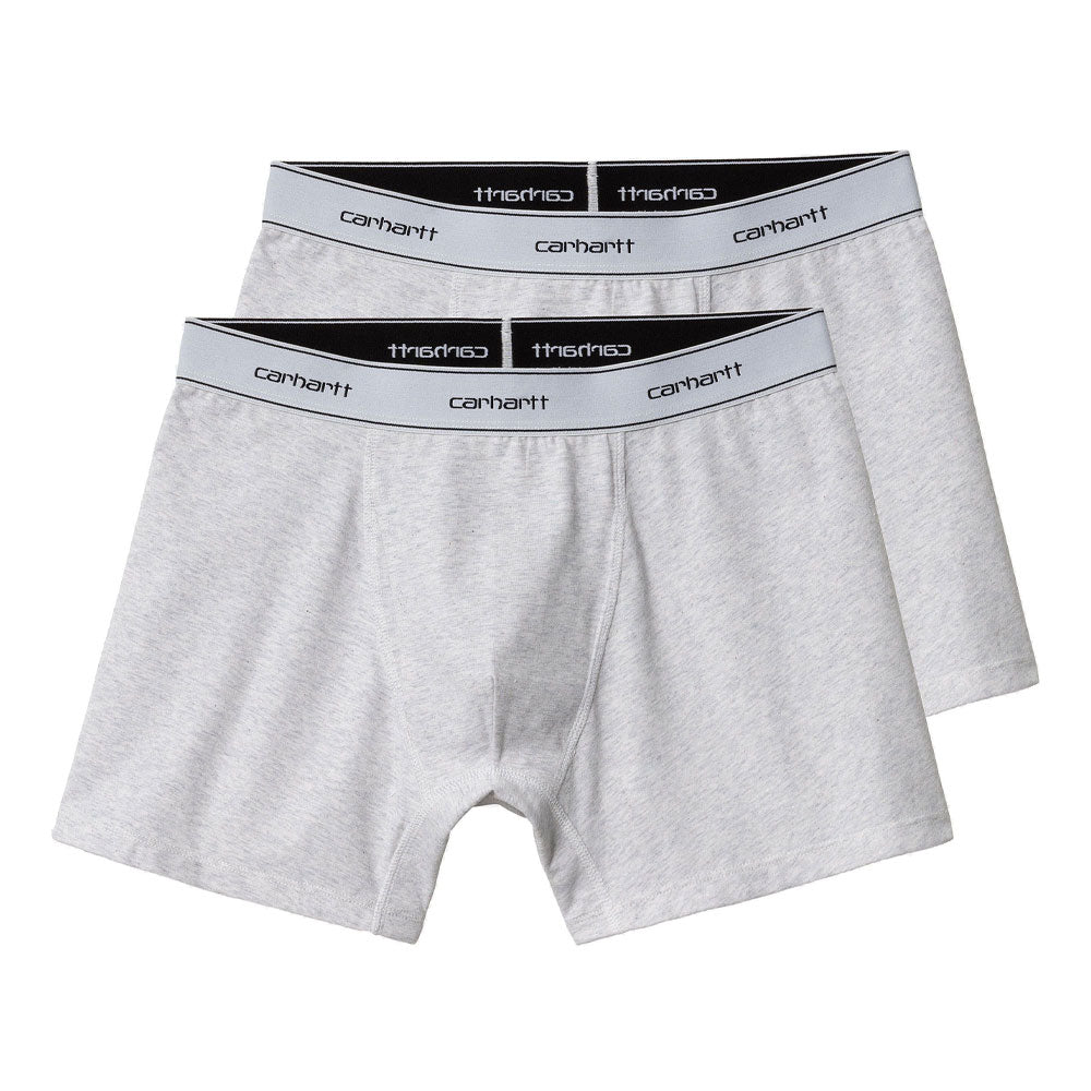 Two gray Carhartt WIP cotton trunks with branded elastic waistbands, laid out flat.