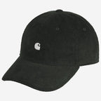A black corduroy baseball cap with a small white embroidered Carhartt logo on the front, set against a plain light gray background.