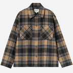 A long-sleeve plaid button-up shirt by Barbour, featuring a black, gray, and mustard yellow tartan pattern with two chest pockets, shown flat on a light gray background.