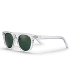 Clear acetate sunglasses with dark green lenses, featuring a small gold logo on the temple arm, set against a plain white background.