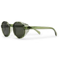 Oversized round sunglasses with a translucent olive green frame, dark lenses, and a silver-toned decorative metal accent on the front, shown on a white background.