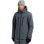 A man wearing a gray technical outdoor jacket with black zippers, a matching gray beanie, and black gloves, photographed against a plain white background.