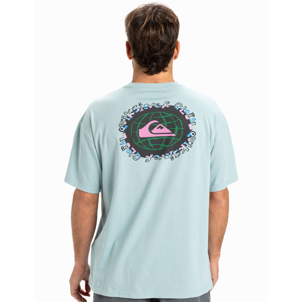 Person wearing a light blue t-shirt with a colorful graphic on the back, standing against a white background.