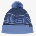 A navy blue knit beanie with a light blue pom-pom, featuring a large light blue 'quiksilver' logo across the front, white decorative stripes, and a light blue folded cuff with a small black brand tag.