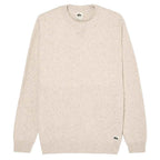 A cream-colored knit sweater with subtle speckled flecks, featuring a crew neck, ribbed cuffs, and a small Quiksilver logo near the lower hem.