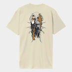 A cream-colored short-sleeve t-shirt shown from the back, featuring a large graphic print of a skeleton figure holding a brown skull-like object, set against a light gray background.