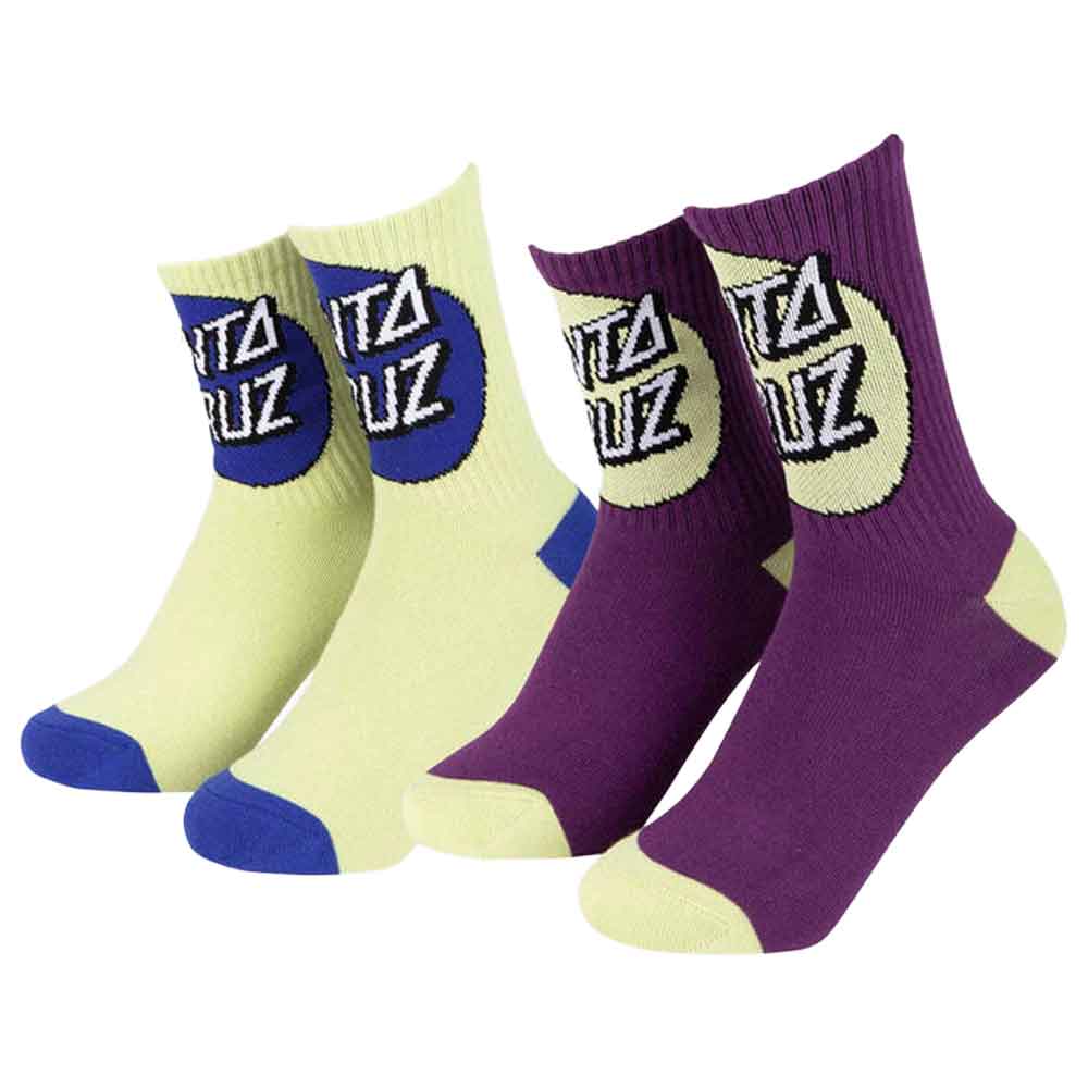 Two pairs of crew socks shown on a plain white background: pale yellow with blue toe/heel and a blue logo panel, purple with cream logo panel and heel/toe accents, and a third pair in pale yellow with blue accents. The socks feature a stylized 'Toto Ruiz' logo.