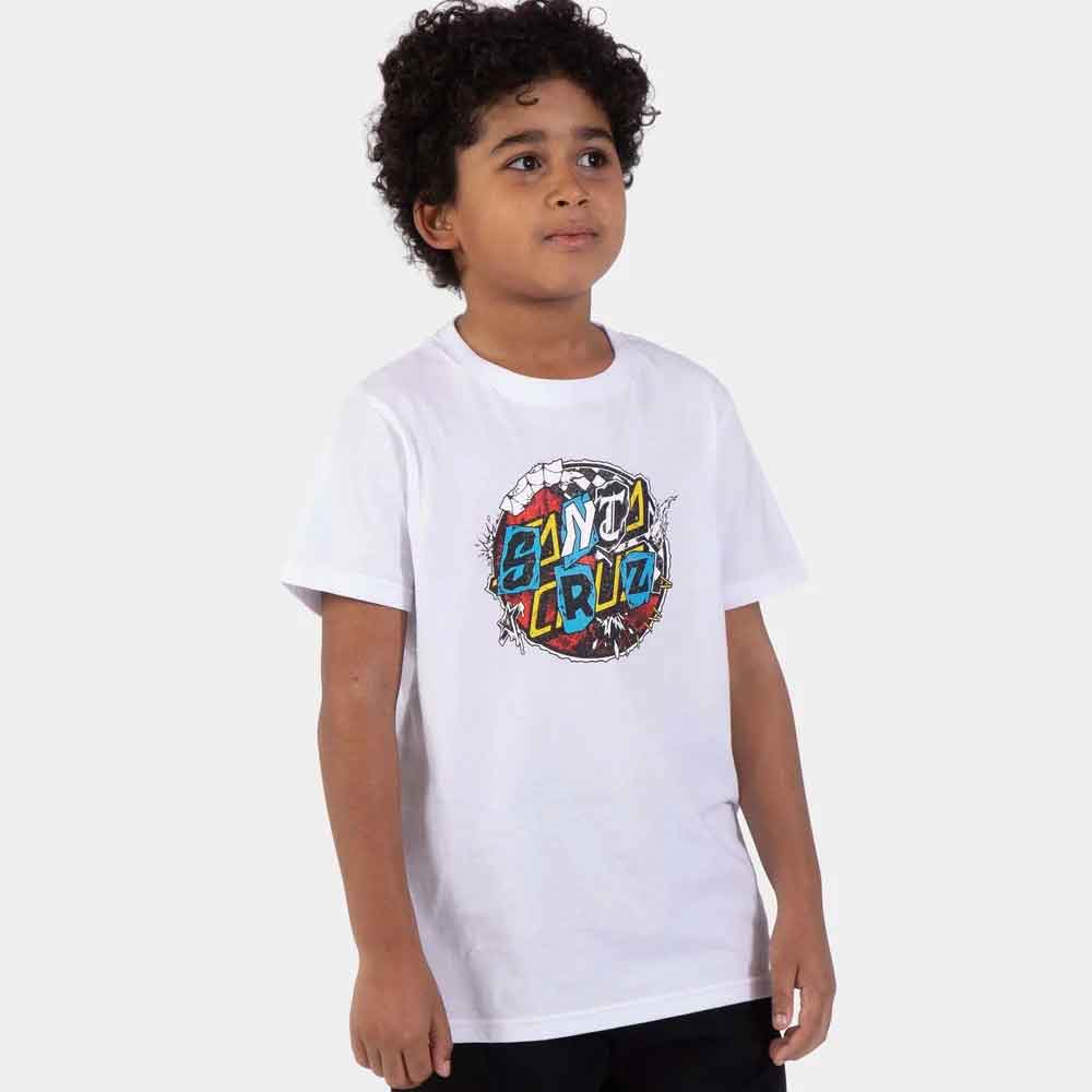 A young boy wearing a white Santa Cruz t-shirt with a colorful graffiti-style graphic on the chest, set against a plain light gray background.