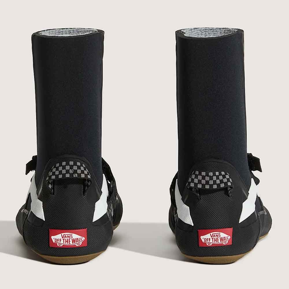 black wetsuit boots with white side stripes and hook-and-loop strap closures, displayed on a light beige background.
