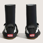 black wetsuit boots with white side stripes and hook-and-loop strap closures, displayed on a light beige background.
