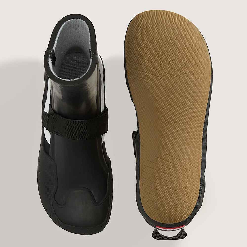 black wetsuit boots with white side stripes and hook-and-loop strap closures, displayed on a light beige background.