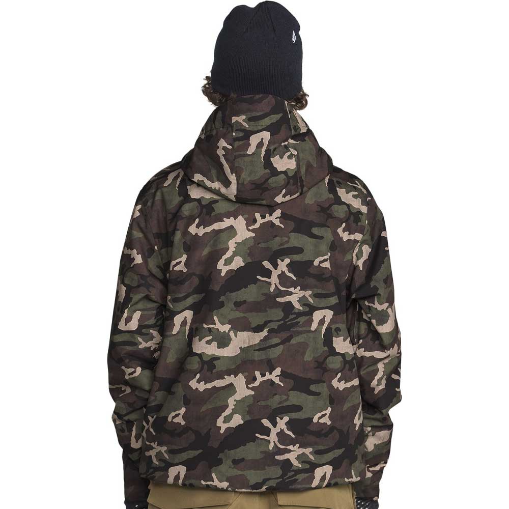 A person shown from the back wearing a camouflage hooded jacket, a black beanie, and tan pants against a plain white background.