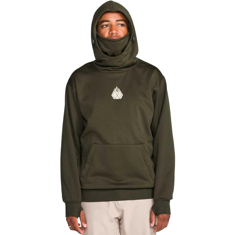 A person wearing an olive green hooded sweatshirt with a built-in neck gaiter and a small white geometric logo on the chest, paired with light beige pants, against a plain white background.