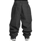 Rear view of dark gray baggy snowboard pants with zippered back pockets and elastic cuffs, shown on a white background.