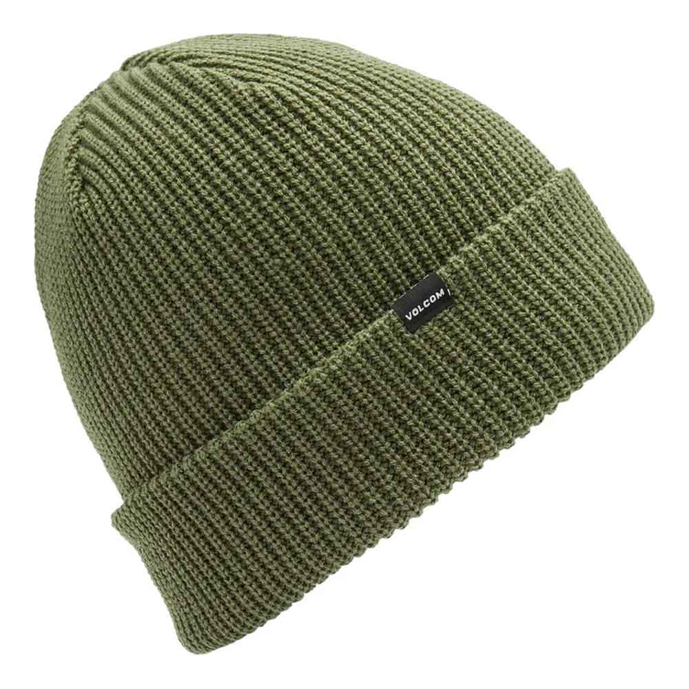 An olive green ribbed knit beanie hat with a small black Volcom logo patch on the cuff, shown against a plain white background.